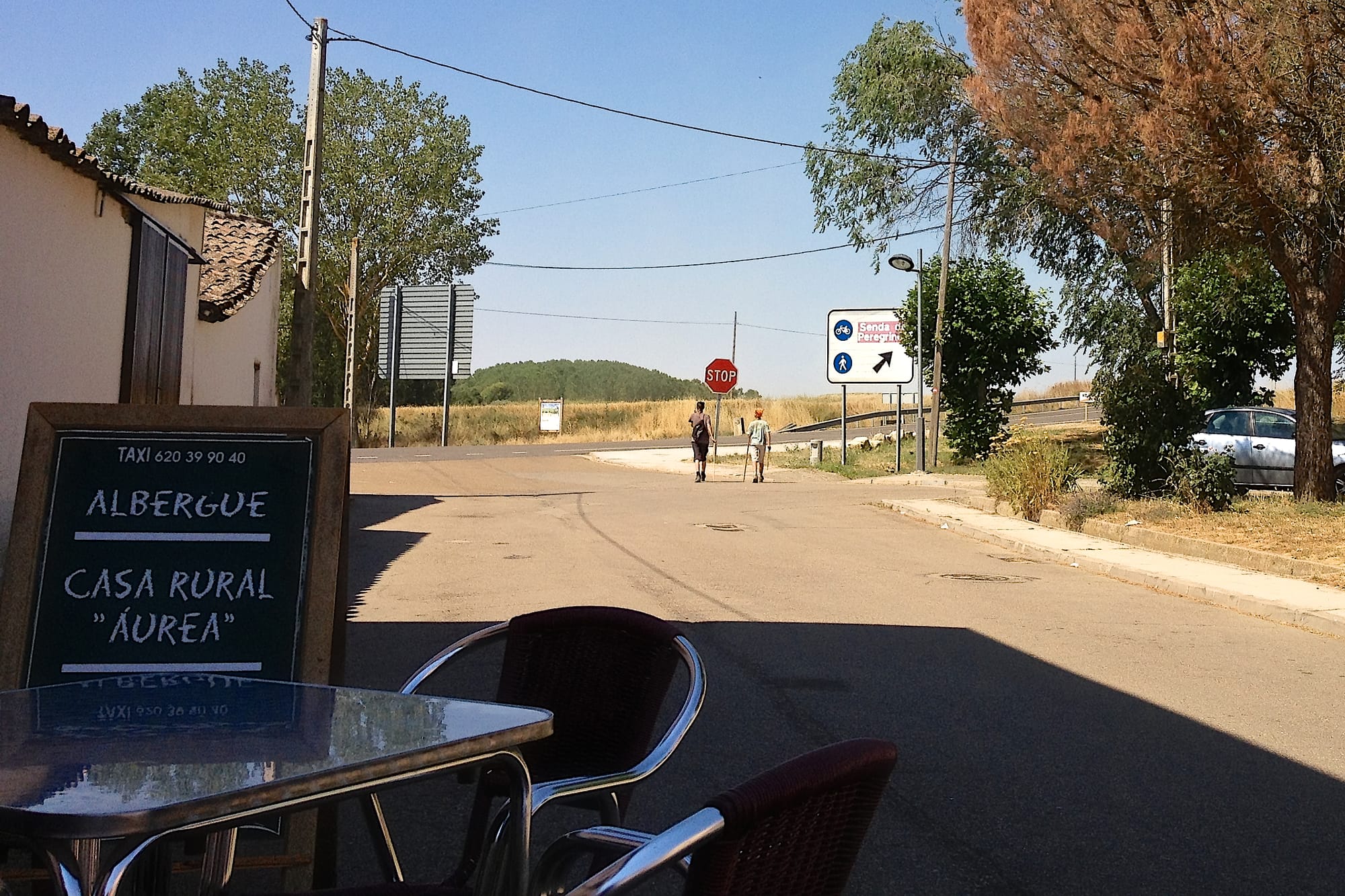 Two boys, aged 16 and 12, walk out of a village into their future, on The Camino, watched by their mother, Melanie Gow who knows the next time she sees them they'll be men